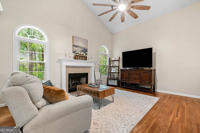 164 Stoneforest Dr, Woodstock, GA 30189 - living room with ceiling fan, a fireplace, wood finished floors, and high vaulted ceiling