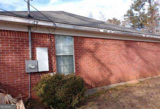 906 Saint Nicholas Ave, Brewton, AL 36426 - view of side of home featuring brick siding