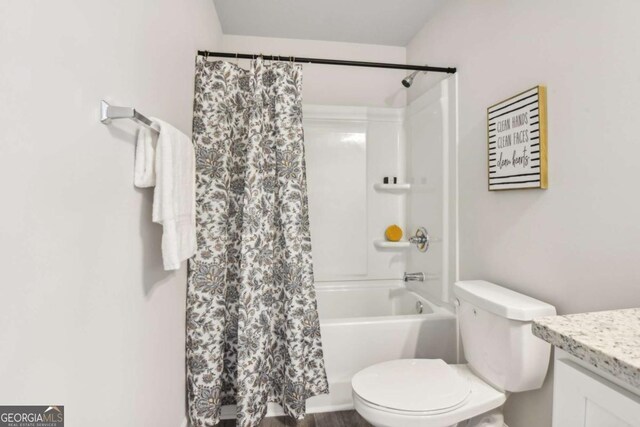 full bath with vanity, toilet, and shower / tub combo