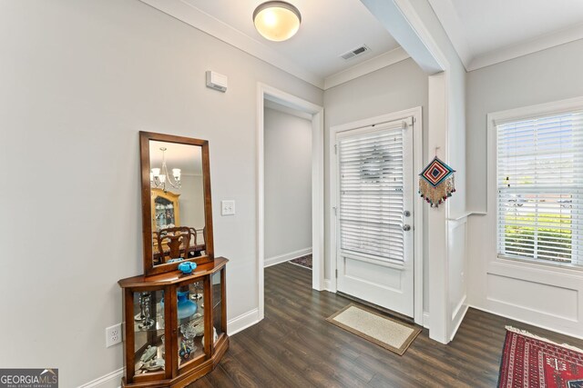 3219 Blackshear Dr, Marietta, GA 30060 - foyer entrance featuring ornamental molding, dark wood finished floors, a chandelier, and baseboards