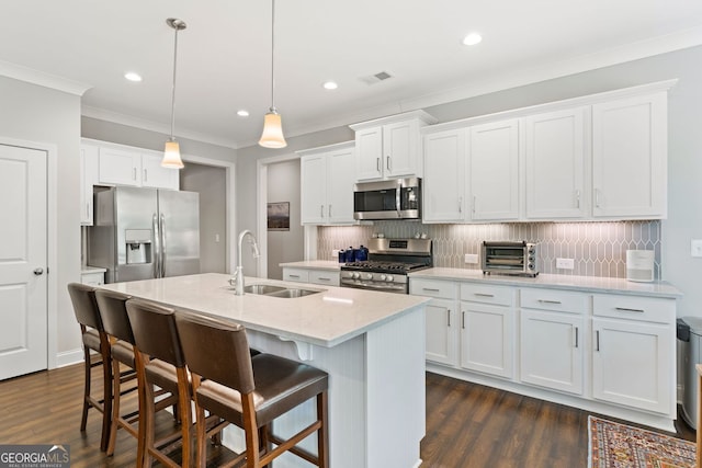3219 Blackshear Dr, Marietta, GA 30060 - kitchen with stainless steel appliances, a sink, ornamental molding, backsplash, and an island with sink