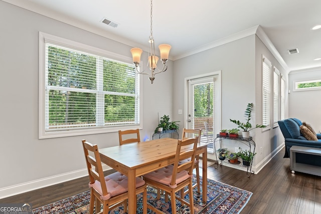 3219 Blackshear Dr, Marietta, GA 30060 - dining room with a chandelier, baseboards, dark wood-type flooring, and crown molding