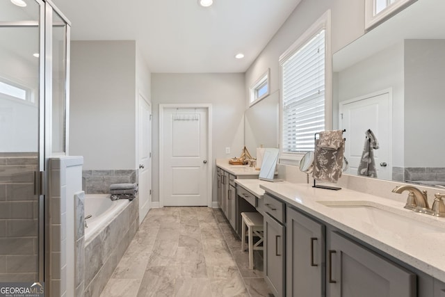 3219 Blackshear Dr, Marietta, GA 30060 - full bath with double vanity, a garden tub, a shower stall, marble finish floors, and recessed lighting