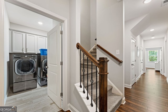 3219 Blackshear Dr, Marietta, GA 30060 - laundry room featuring washer and dryer, wood finished floors, baseboards, cabinet space, and recessed lighting