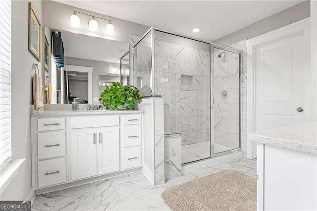 1700 Prospect Way, Conyers, GA 30094 - bathroom with marble look tile flooring, a marble finish shower, vanity, and recessed lighting