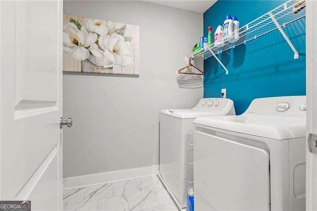 1700 Prospect Way, Conyers, GA 30094 - washroom featuring washer and clothes dryer, marble look tile flooring, and baseboards