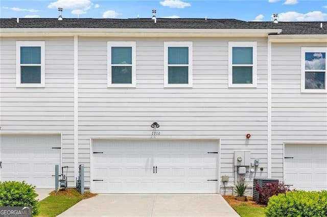 1700 Prospect Way, Conyers, GA 30094 - view of property exterior with central AC, a garage, and driveway