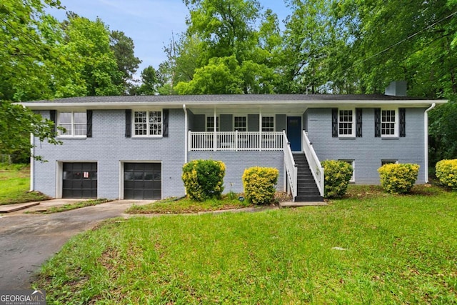 6549 Biscayne Way, Douglasville, GA 30135 - bi-level home featuring stairs, brick siding, driveway, a garage, and a front lawn