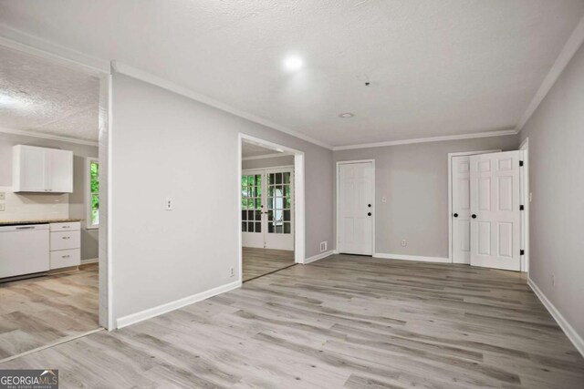 6549 Biscayne Way, Douglasville, GA 30135 - unfurnished room featuring ornamental molding, light wood-type flooring, a textured ceiling, and baseboards