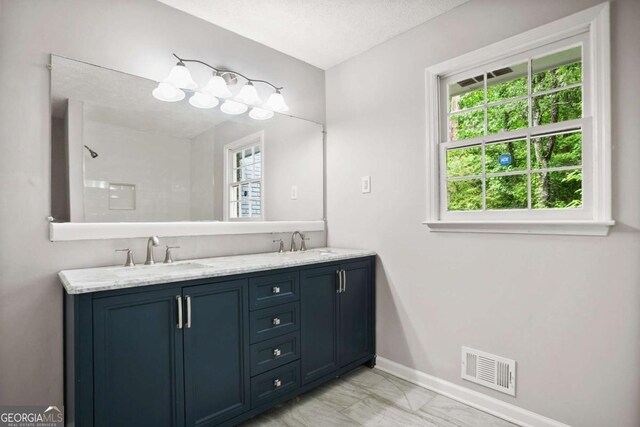 6549 Biscayne Way, Douglasville, GA 30135 - full bath with marble finish flooring, baseboards, and double vanity