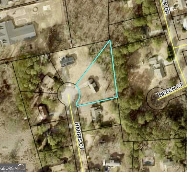 aerial map of property and surrounding area with property boundaries highlighted