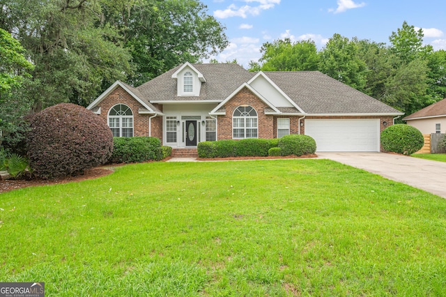 124 Cinder Hill Dr, Brunswick, GA 31523 - view of front of house featuring brick siding, a garage, a front yard, concrete driveway, and a shingled roof