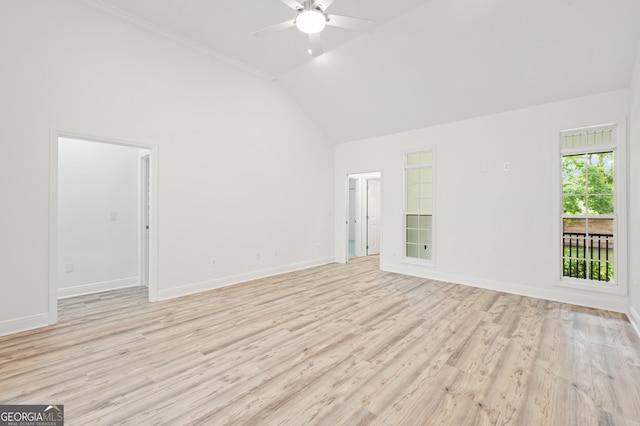124 Cinder Hill Dr, Brunswick, GA 31523 - unfurnished living room featuring ceiling fan, light wood-style flooring, baseboards, and high vaulted ceiling