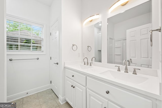124 Cinder Hill Dr, Brunswick, GA 31523 - bathroom featuring double vanity, baseboards, and tile patterned flooring