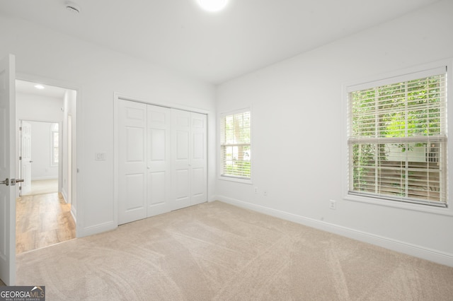 124 Cinder Hill Dr, Brunswick, GA 31523 - unfurnished bedroom with light carpet, baseboards, and a closet