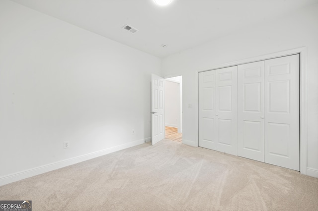 124 Cinder Hill Dr, Brunswick, GA 31523 - unfurnished bedroom with carpet floors, baseboards, and a closet