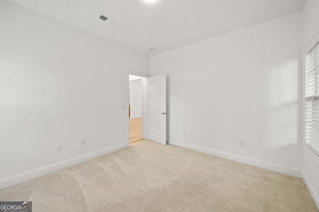 124 Cinder Hill Dr, Brunswick, GA 31523 - empty room with light carpet and baseboards