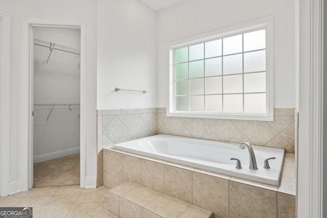 124 Cinder Hill Dr, Brunswick, GA 31523 - full bath featuring a spacious closet, a bath, and tile patterned flooring
