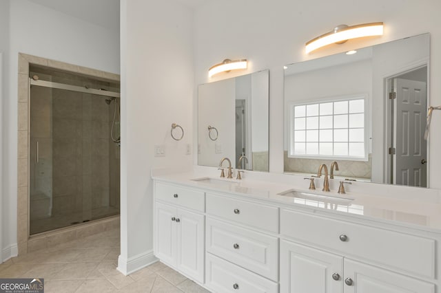 124 Cinder Hill Dr, Brunswick, GA 31523 - bathroom featuring a stall shower, tile patterned floors, double vanity, and baseboards