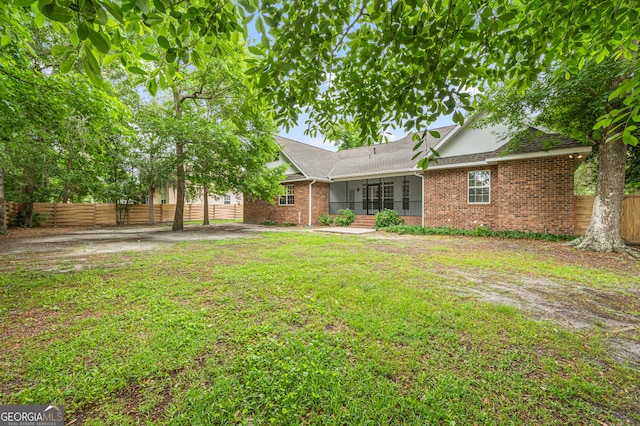 124 Cinder Hill Dr, Brunswick, GA 31523 - rear view of property featuring brick siding and a shingled roof