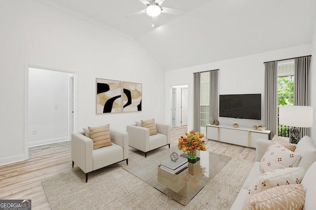 124 Cinder Hill Dr, Brunswick, GA 31523 - living area featuring light wood finished floors, high vaulted ceiling, a ceiling fan, and baseboards
