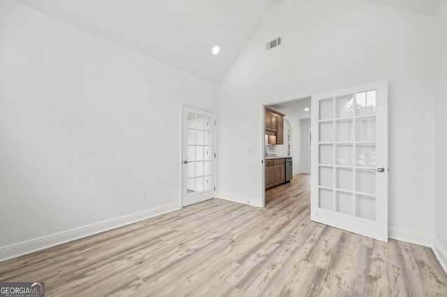 124 Cinder Hill Dr, Brunswick, GA 31523 - unfurnished room with light wood-style flooring, baseboards, high vaulted ceiling, recessed lighting, and a sink