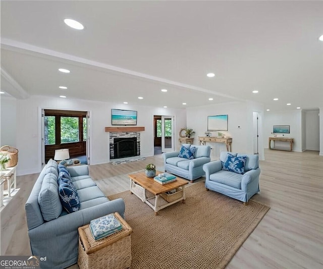 9460 Chestatee Ct, Gainesville, GA 30506 - living room featuring recessed lighting, a stone fireplace, and light wood-style flooring