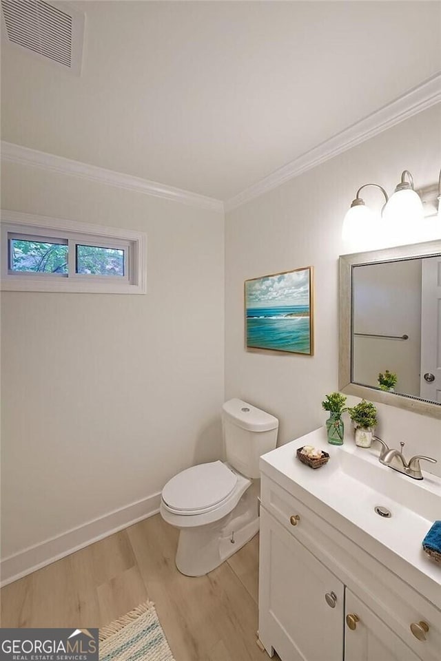 9460 Chestatee Ct, Gainesville, GA 30506 - half bathroom featuring wood finished floors, vanity, and crown molding