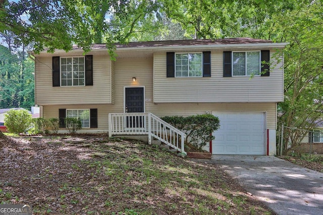 5295 Old Trail Cir, Stone Mountain, GA 30088 - raised ranch with an attached garage and driveway