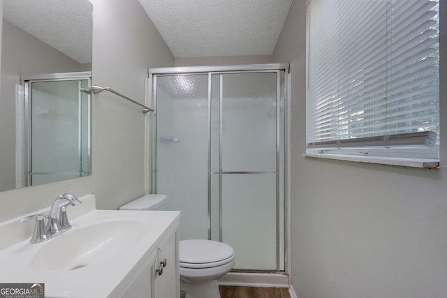 5295 Old Trail Cir, Stone Mountain, GA 30088 - full bathroom with a textured ceiling, a shower stall, vanity, and wood finished floors