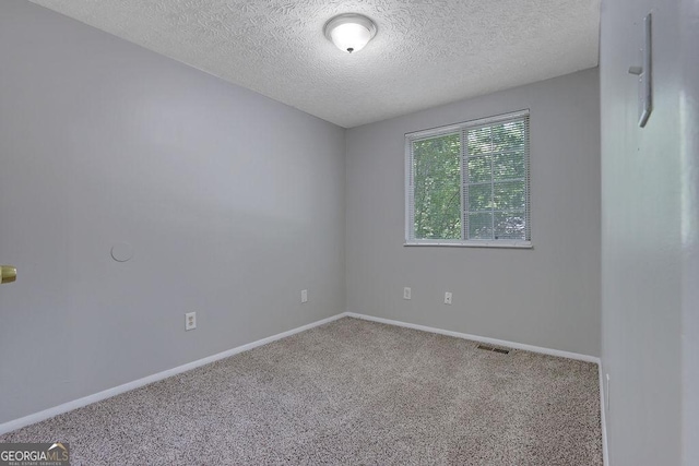 5295 Old Trail Cir, Stone Mountain, GA 30088 - carpeted empty room with a textured ceiling and baseboards