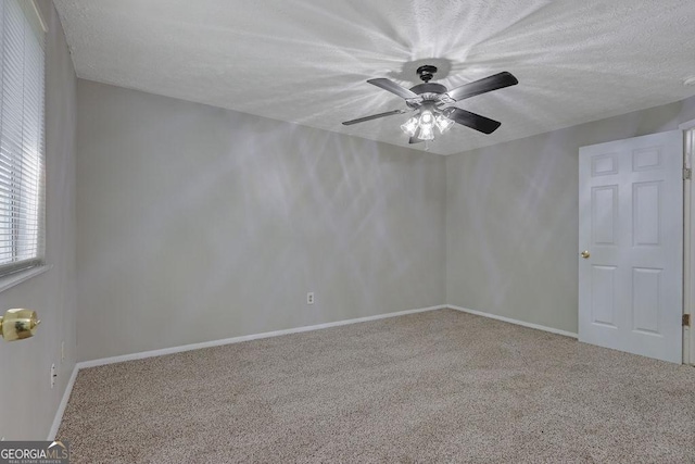 5295 Old Trail Cir, Stone Mountain, GA 30088 - carpeted spare room featuring ceiling fan and a textured ceiling