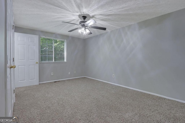 5295 Old Trail Cir, Stone Mountain, GA 30088 - carpeted spare room featuring a textured ceiling and a ceiling fan
