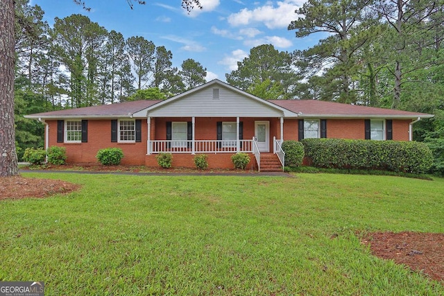 ranch-style house featuring a porch, brick siding, and a front lawn