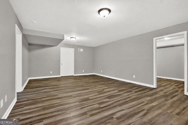 finished basement with dark wood finished floors and baseboards