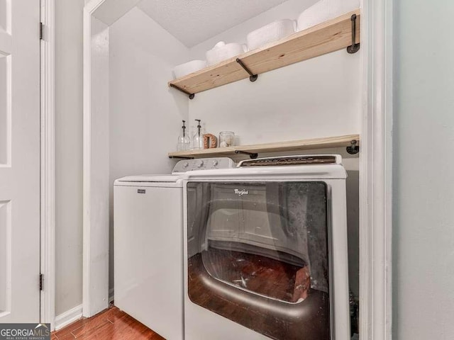 3500 Refuge Rd, Jasper, GA 30143 - washroom with washing machine and clothes dryer, wood finished floors, and baseboards