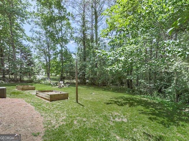 3500 Refuge Rd, Jasper, GA 30143 - view of green lawn with a vegetable garden