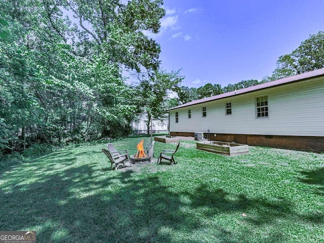 3500 Refuge Rd, Jasper, GA 30143 - view of grassy yard with a fire pit and central AC unit