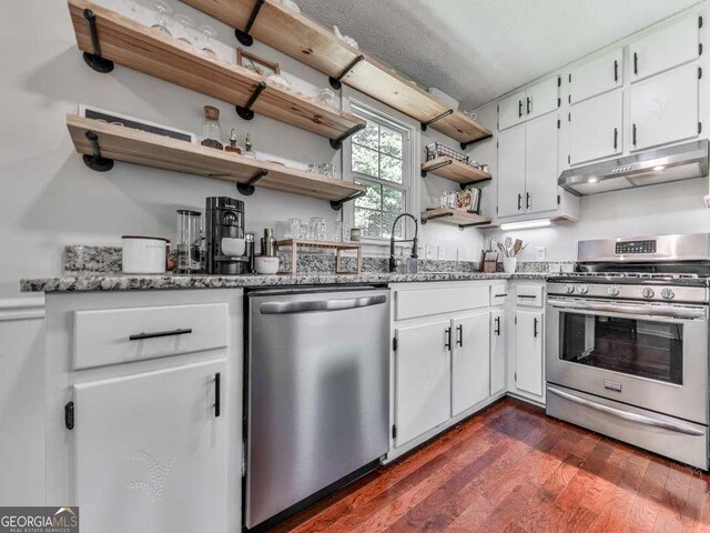 3500 Refuge Rd, Jasper, GA 30143 - kitchen with appliances with stainless steel finishes, under cabinet range hood, open shelves, light stone countertops, and white cabinetry