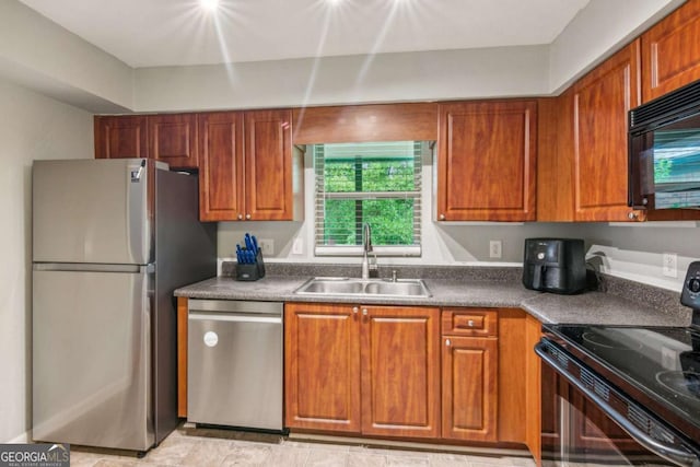 721 Beaufort Cir, Duluth, GA 30096 - kitchen with black appliances, brown cabinets, and dark countertops