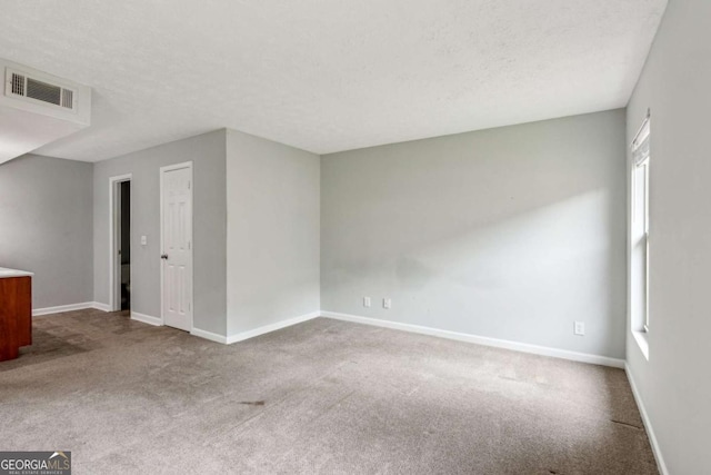 721 Beaufort Cir, Duluth, GA 30096 - spare room with carpet flooring and a textured ceiling