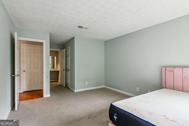 721 Beaufort Cir, Duluth, GA 30096 - bedroom featuring carpet floors and a textured ceiling