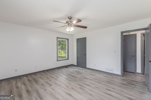 5406 Jamestowne Dr, Powder Springs, GA 30127 - empty room with light wood-type flooring, a ceiling fan, and baseboards