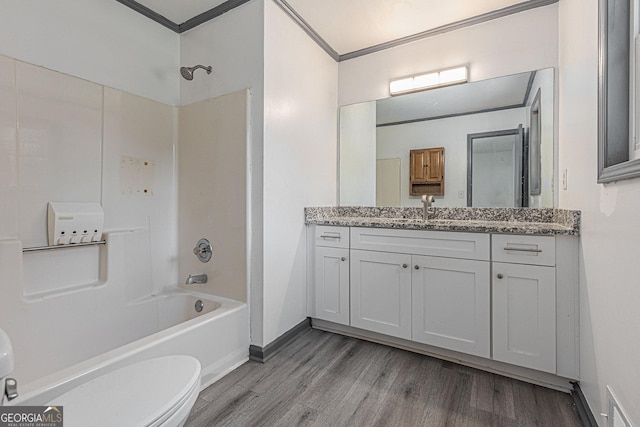 5406 Jamestowne Dr, Powder Springs, GA 30127 - bathroom featuring wood finished floors, tub / shower combination, toilet, vanity, and ornamental molding