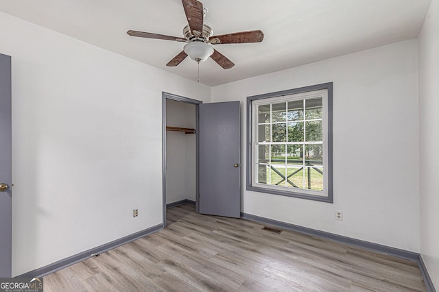 5406 Jamestowne Dr, Powder Springs, GA 30127 - unfurnished bedroom featuring light wood-type flooring, baseboards, a closet, and ceiling fan