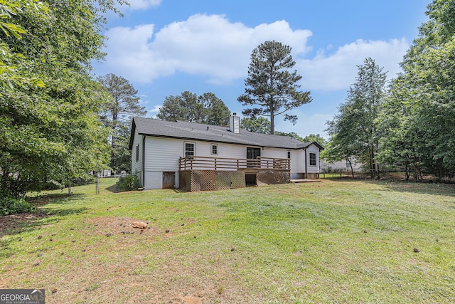 5406 Jamestowne Dr, Powder Springs, GA 30127 - rear view of house with a wooden deck and a chimney
