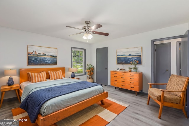 5406 Jamestowne Dr, Powder Springs, GA 30127 - bedroom with light wood-style floors and ceiling fan