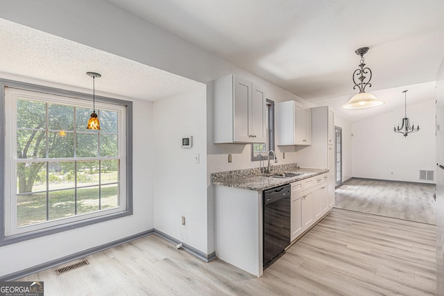 5406 Jamestowne Dr, Powder Springs, GA 30127 - kitchen with black dishwasher, a sink, light wood finished floors, a chandelier, and light stone countertops