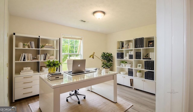 office space with wood finished floors