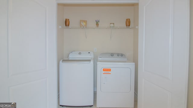 laundry room with separate washer and dryer